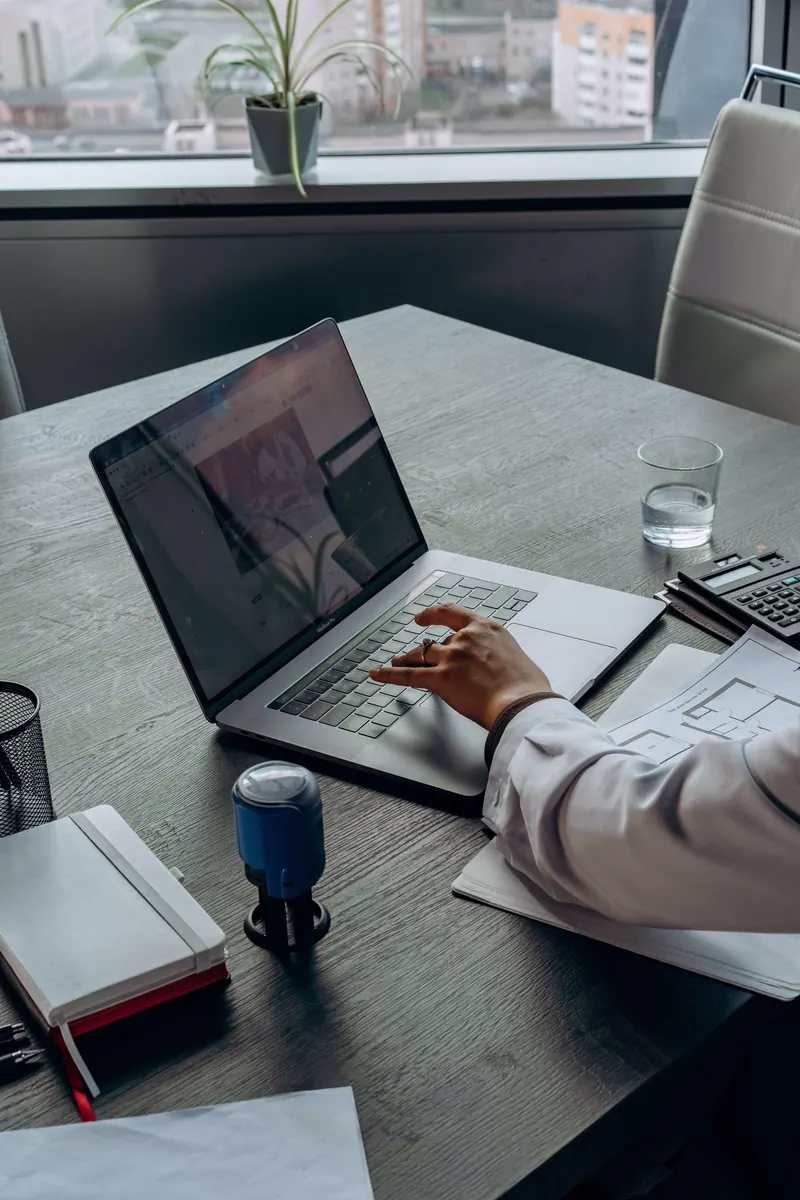 A professional managing tasks efficiently at their desk