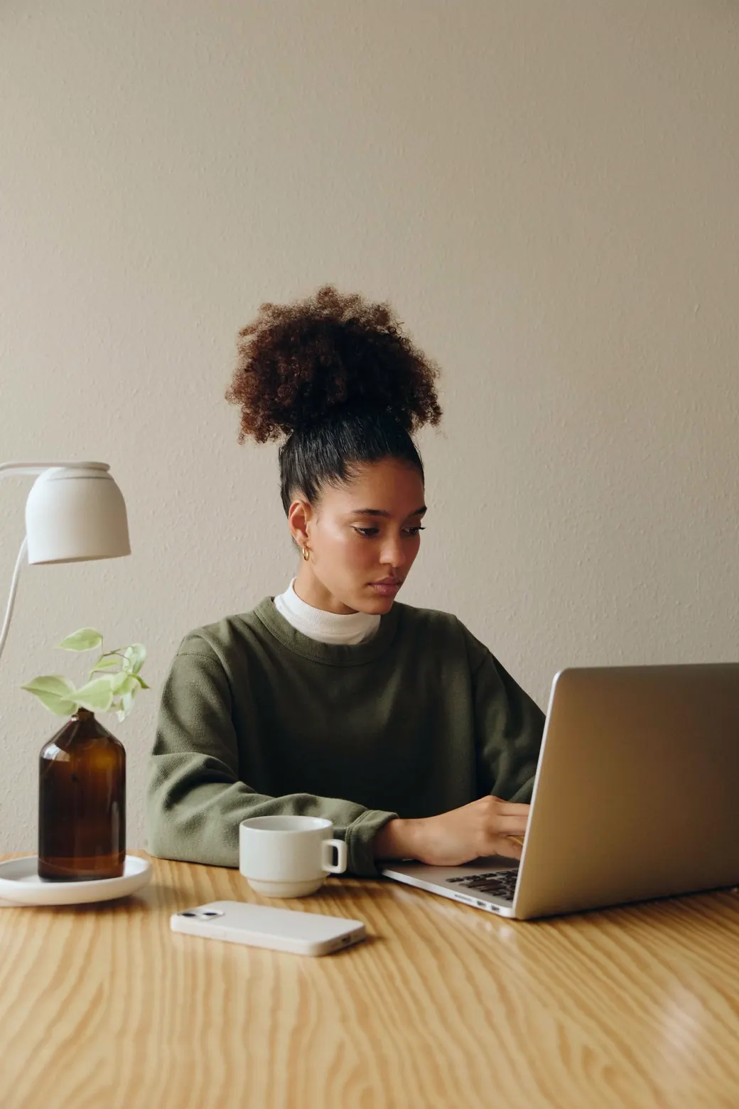 A happy entrepreneur working confidently at his desk
